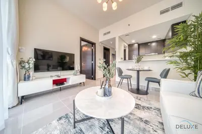 a living room with a couch and a table at Soothing 1BR at Merano Business Bay by Deluxe Holiday Homes in Dubai