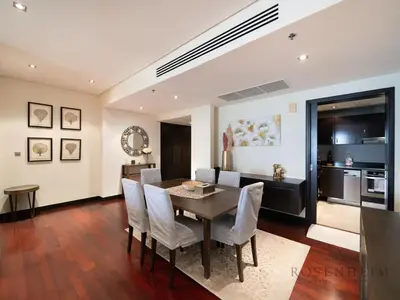 a dining room with a table and chairs at Luxury Anantara Res - Sea & Burj AlArab View in Dubai