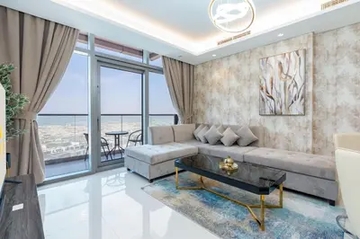 a living room with a couch and a table at LuxBnB Paramount Midtown SeaView in Dubai