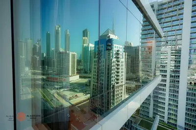 a view of a city skyline from a skyscraper at Modern Spacious 2BR Canal View -Business Bay in Dubai