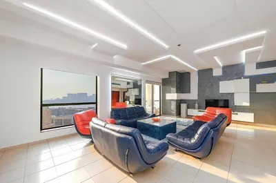a living room with couches and a table at Elan Rimal Suites JBR Beach Sea View in Dubai