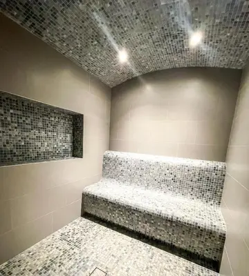 a room with a couch in a room with tiles at STAY BY LATINEM Luxury 1BR Holiday Home CV B905 near Burj Khalifa in Dubai