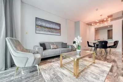 a living room with a couch and a table at Damac Heights, Dubai Marina - Mint Stay in Dubai