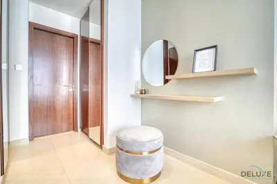 a bathroom with a stool and a mirror at Surreal 1BR at The Residence Marina Gate 2 Dubai Marina by Deluxe Holiday Homes in Dubai