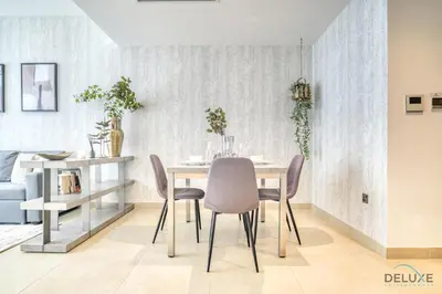 a dining room with a table and chairs at Surreal 1BR at The Residence Marina Gate 2 Dubai Marina by Deluxe Holiday Homes in Dubai