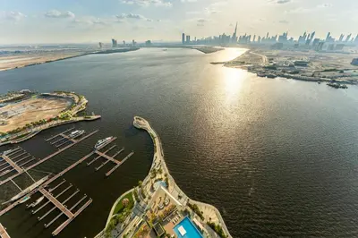 an aerial view of the city of dubai from the water at Maison Privee - Trendy Apt on the Creek w/ Superb Dubai Skyline Vw in Dubai