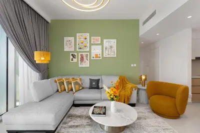 a living room with a couch and a table at Maison Privee - Trendy Apt on the Creek w/ Superb Dubai Skyline Vw in Dubai