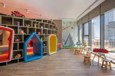 a childrens room with a play area with a play set at StoneTree - Paramount Tower Hotel&Residences 2 BR - Amazing View in Dubai