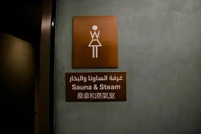 a sign on the door of a bathroom at Lux Studio in Downtown, 5 mins to Burj Khalifa & Dubai Mall - MAG318 in Dubai