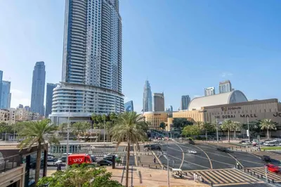 a city with tall buildings and a street with cars at GuestReady - Sweet Sunshine in Downtown in Dubai