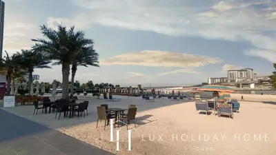 a beach with tables and chairs on the beach at LUX The JBR Beach Sea View Suite in Dubai