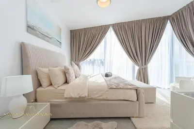 a bedroom with a bed and a large window at Marco Polo - Wake up to stunning sea views at Stella Maris in Dubai