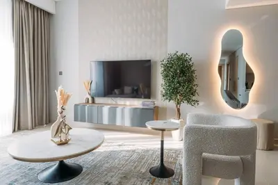 a living room with a couch and a chair at Modern & Chic 2bedroom with Balcony Dubai Creek in Dubai