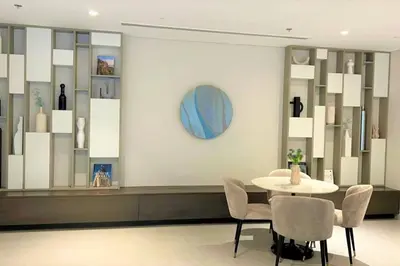 a dining room with a table and chairs and a mirror at Modern & Chic Waterfront 2bed balcony Dubai Creek in Dubai