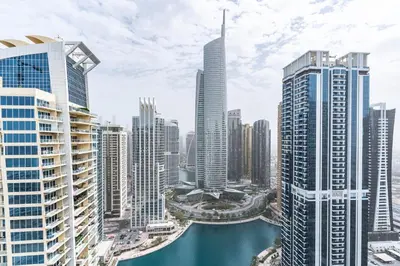 a view of a city with a river and buildings at Scenic lake view 2BR near metro in Cluster A, JLT - Allsopp&Allsopp in Dubai