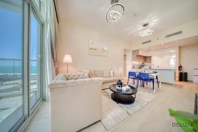 a living room with a couch and a table at Peaceful 1BR in Studio One Dubai Marina by Deluxe Holiday Homes in Dubai