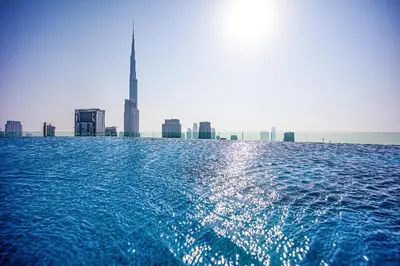 a large body of water with a city in the background at Luxury 3 bedroom apartment in Paramount Midtown in Dubai