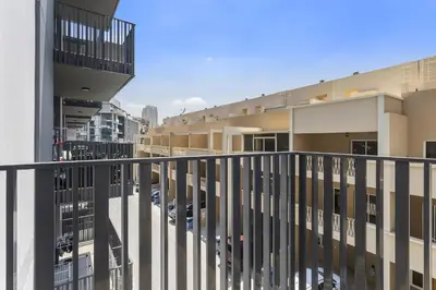 an apartment balcony with a view of a parking lot at Silkhaus Modern Studio In a Quiet Neighborhood in Dubai