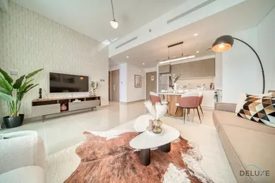 a living room with a couch and a table at Captivating 1BR at 17 Icon Bay Dubai Creek Harbour by Deluxe Holiday Homes in Dubai