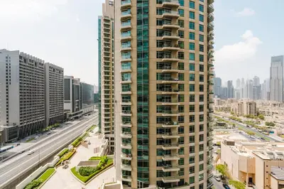 a tall building in the middle of a city at RH- City Center Retreat,1BR, walk to Burj Khalifa in Dubai