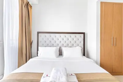 a bedroom with a large white bed with white sheets at StoneTree - Ocean Heights 1 BR - High Floor in Dubai