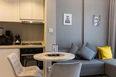 a small living room with a couch and a table at Business Bay 1 bedroom with Canal view in Dubai