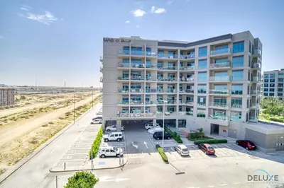 an aerial view of a hotel with a parking lot at Classic 1BR at MAG 510 Dubai South by Deluxe Holiday Homes in Dubai