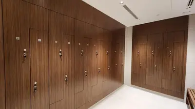 a row of wooden lockers in a locker room at STAY BY LATINEM Luxury 1BR Holiday Home CVR A3002 near Burj Khalifa in Dubai