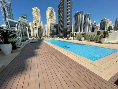 a swimming pool in the middle of a city with tall buildings at Luxury Residence Stella Maris in Dubai
