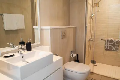 a bathroom with a sink and a toilet and a shower at Al Bateen Residences, Jumeirah Beach Residence - Mint Stay in Dubai