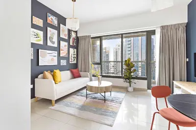 a living room with a couch and a table at Silkhaus with Burj Khalifa view1BDR with modern amenities in Dubai