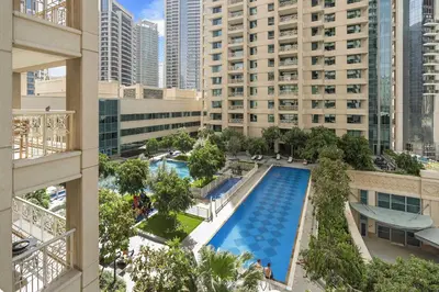 an overhead view of a pool in a city with tall buildings at Silkhaus with Burj Khalifa view1BDR with modern amenities in Dubai