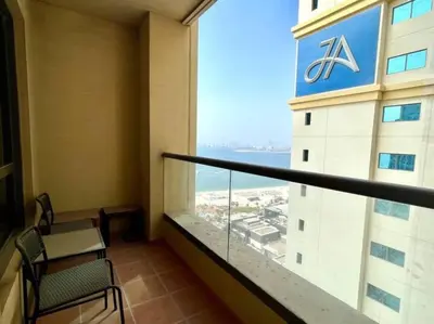 a balcony of a hotel with a view of the ocean at JBR Sea View 2 Bedroom Apartment in Dubai