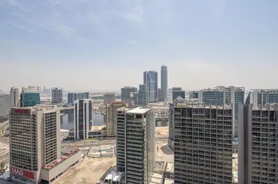 an aerial view of a city with tall buildings at Frank Porter - Burj Views Tower A in Dubai