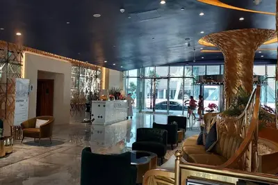 a lobby with a large room with couches and chairs at Winds of the Canal by Lagom - Business Bay Dubai in Dubai