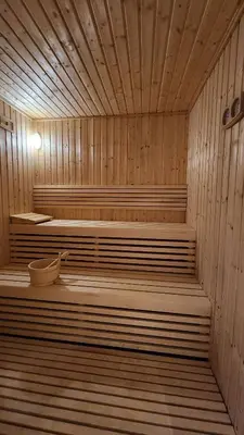 a wooden sauna with two beds in it at STAY La Casa Da Vinci 1BR Holiday Home CVR B3002 near Burj Khalifa in Dubai
