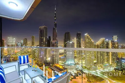 a view of a city skyline at night at LUX Paramount Burj View Business Bay in Dubai