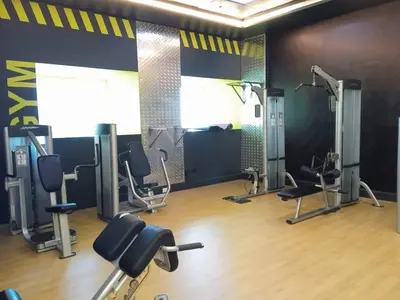 a gym with treadmills and chairs in a room at High Floor Elegance,Prime Location-Close to tram in Dubai