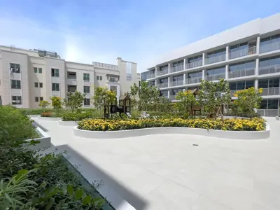 an empty courtyard in front of a building at Very Cozy & Relaxing Studio in JVC in Dubai