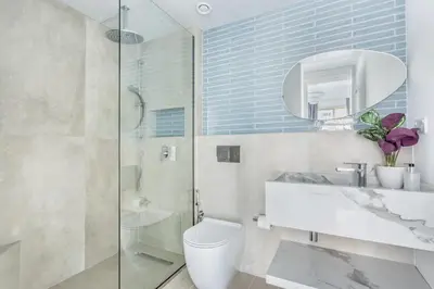a bathroom with a toilet and a sink and a shower at Frank Porter - Al Ghozlan 4 in Dubai