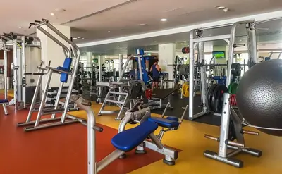 a gym with a lot of equipment in it at Maison Privee - Splendid Apt on The Palm with Stunning Sea Views in Dubai