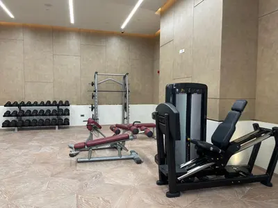 a gym with several exercise equipment in a room at LHG PALM JUMEIRAH Tallest RoofTop Pool in Dubai