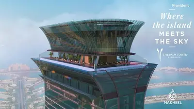 a tall building with the words where the island meets the sky at LHG PALM JUMEIRAH Tallest RoofTop Pool in Dubai