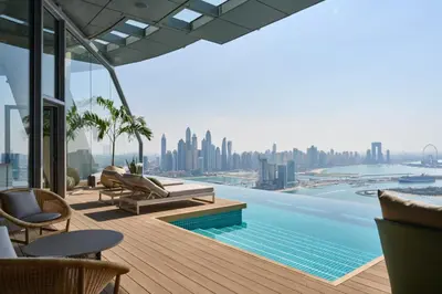 a view of the city from the rooftop of a building at LHG PALM JUMEIRAH Tallest RoofTop Pool in Dubai