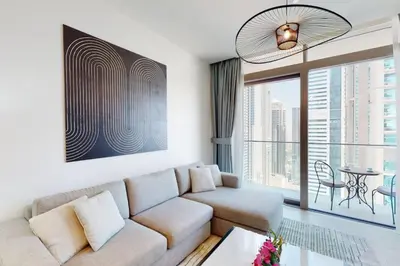 a living room with a couch and a table at Marina Gate 1, Dubai Marina - Chic One Bedroom in Dubai