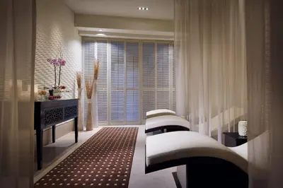 a living room with three chairs and a window at Suitestay Address Dubai Mall Residence in Dubai