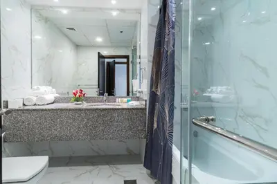 a bathroom with a shower and a sink and a toilet at Amazing BeachFront Apartments near Atlantis Waterpark by Simply Comfort Sarai Palm Jumeirah in Dubai