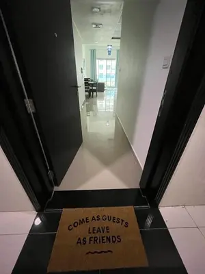 a sign that says entrance excuses leave as friends on a floor at Elegant stay at marina Dubai in Dubai