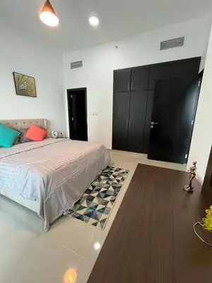 a bedroom with a bed and a black cabinet at Elegant stay at marina Dubai in Dubai
