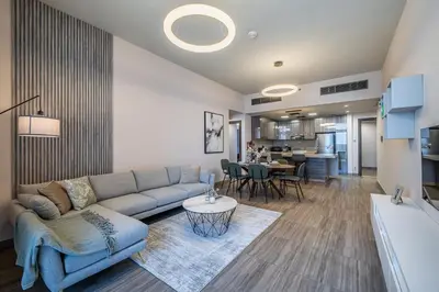 a living room with a couch and a table at MBL I Modern 2 Bedroom Apartment in JLT in Dubai